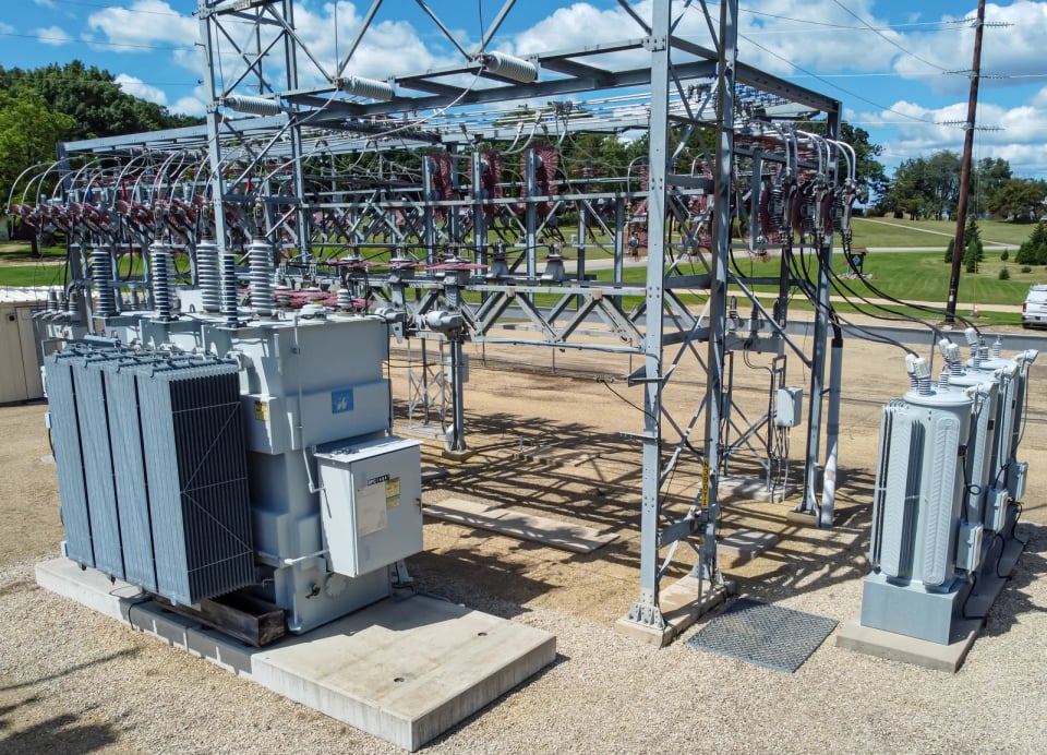Real Wisconsin electrical substation with transformers, steel supports, insulators and overhead connections